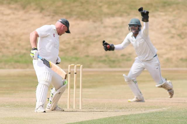 A big shout for a wicket from Buxton against Ashover.