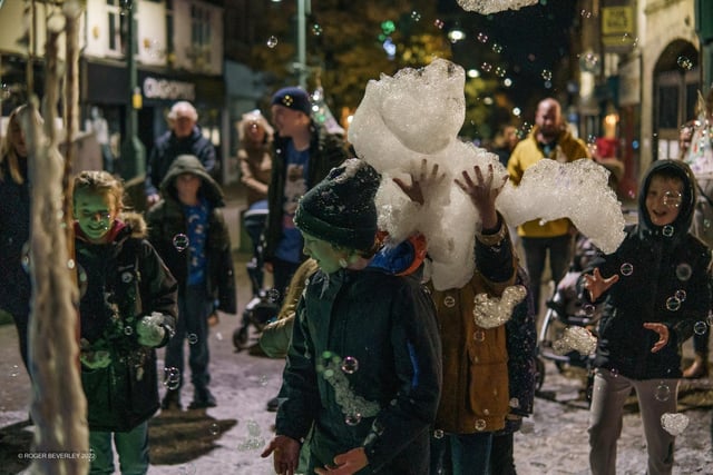 Children enjoying playing with the bubbles from Bubble Man. Picture Roger Beverley.