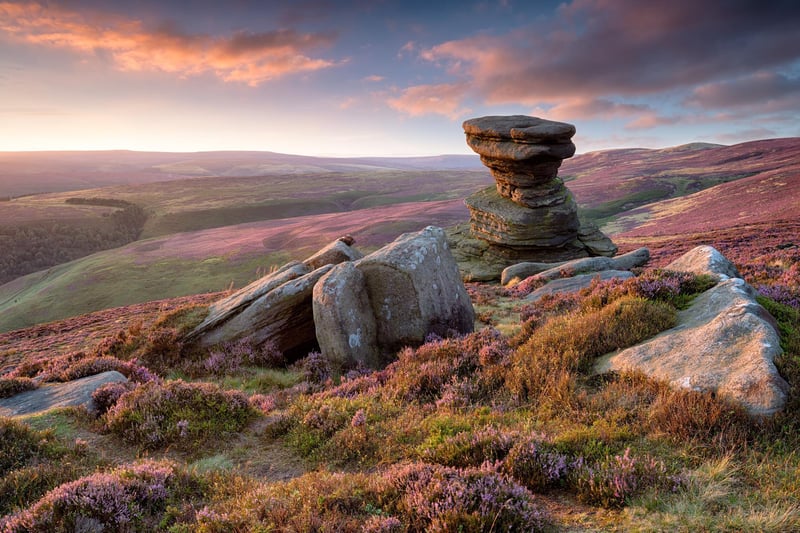 Stunning sunset over the Slat Cellar a weathered rock formation on Derwent Edge high above the Ladybower Reservoir in the Upper Derwent Valley in the Peak District