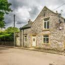 The cottage is situated just off Castleton's market square.
