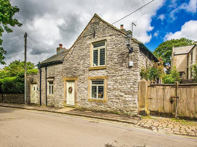 The cottage is situated just off Castleton's market square.