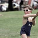 A young child plays cricket wearing sunglasses during a county championship match in 1981 at Chesterfield. (Photo by Adrian Murrell/Allsport/Getty Images/Hulton Archive)