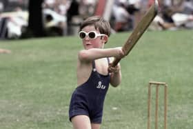 A young child plays cricket wearing sunglasses during a county championship match in 1981 at Chesterfield. (Photo by Adrian Murrell/Allsport/Getty Images/Hulton Archive)
