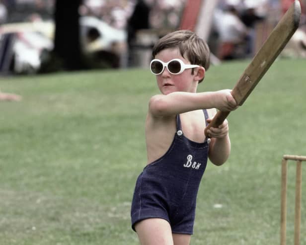 A young child plays cricket wearing sunglasses during a county championship match in 1981 at Chesterfield. (Photo by Adrian Murrell/Allsport/Getty Images/Hulton Archive)