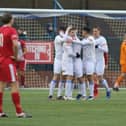 Buxton celebrate their opening goal in the 3-0 win over Ashton. It leaves them two points clear of Matlock at the top of the NPL table.