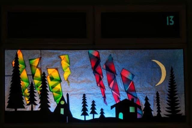 A tissue paper-made representations of the Nativity and the Northern Lights