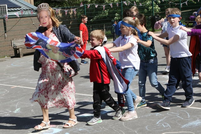 Platinum Jubilee Celebrations as the "Queen" led a conga around the playground at St Annes in Buxton
