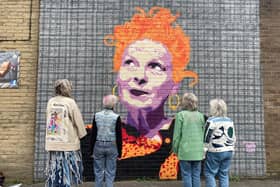The ladies behind New Mills Fashion Week taking their message of sustainability to the Vivienne Westwood mural in Glossop. Photo submitted