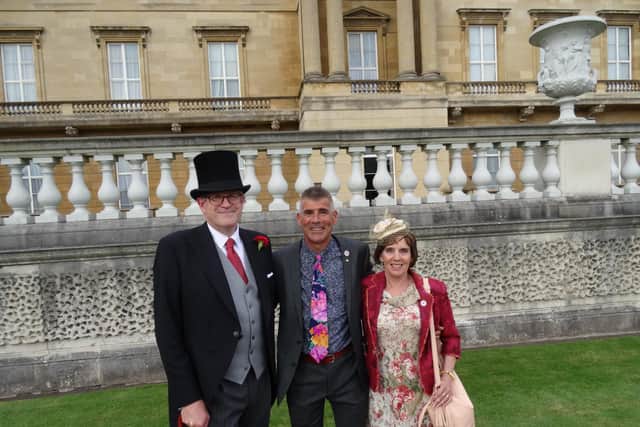 Dave Carlisle and Sue Mellor with Andrew David Parker, left, the Lord Chamberlain of the Household.