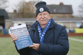 Tony Tomliunson with his book on Buxton FC's post war exploits. Photo Jason Chadwick