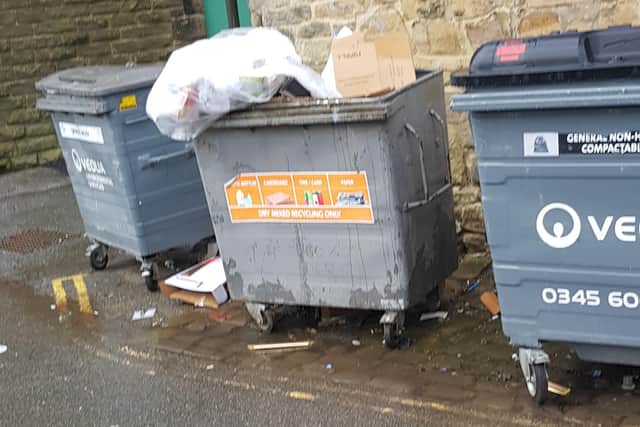 A private contractor would normally be expected to empty these bins.