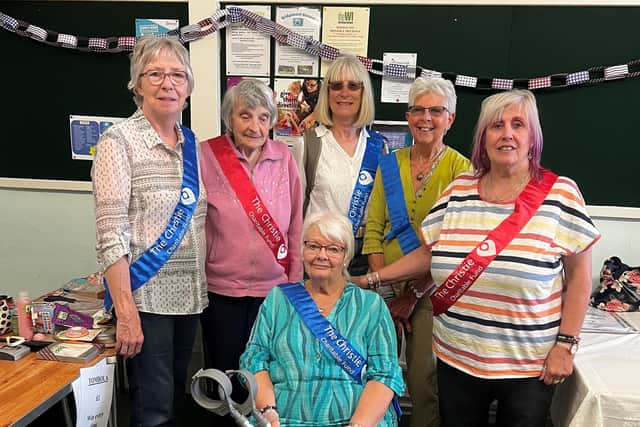 Joyce Shacklock (front) with supporters at a recent coffee morning