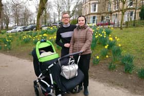 Christopher, Olha and Edward enjoying some family time in Buxton's Pavilion Gardens after Olha and Edward fled war-torn Ukraine