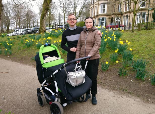 Christopher, Olha and Edward enjoying some family time in Buxton's Pavilion Gardens after Olha and Edward fled war-torn Ukraine