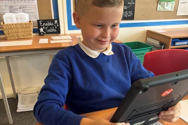 A pupil uses an iPad at Killisick Junior School