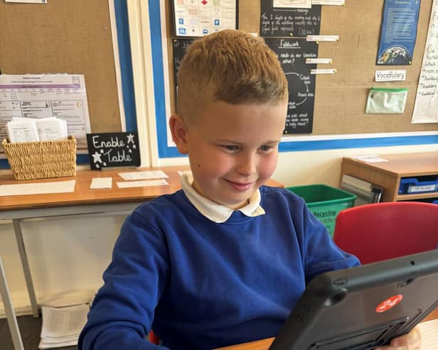A pupil uses an iPad at Killisick Junior School