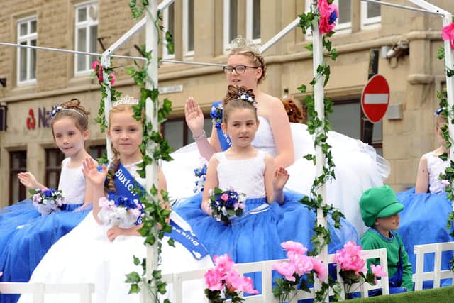Buxton's Well Dressing queen and her retinue during the 2019 Buxton Carnival parade