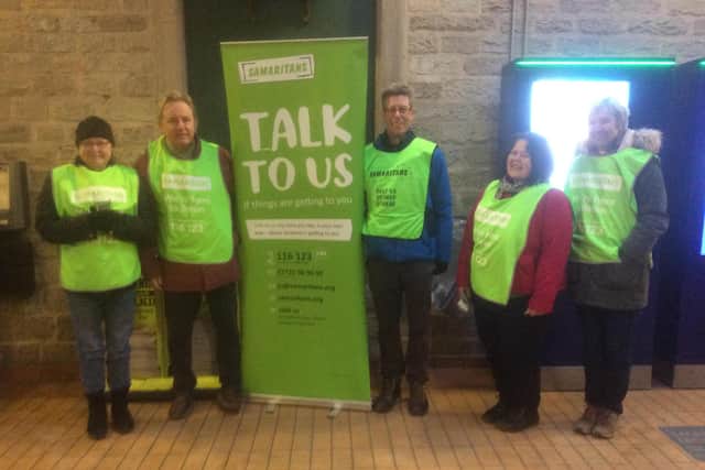 Ian, second left, handed out teabags and smiles with other volunteers to commuters at Glossop Station on January's 'Blue Monday' - renamed 'Brew Monday' during the event.