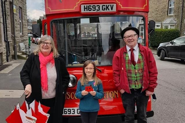 Overall winner Emily with the tram's conductor and driver, Netta and Mike.