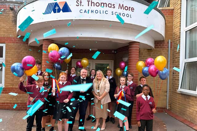 Pupils celebrate with Headteacher David Redfern and Deputy Headteacher Sarah Lancett.