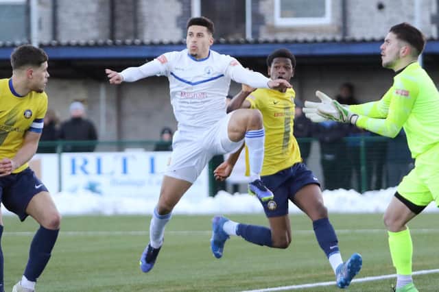 Warren Clarke hailed the battling spirit shown by Buxton as they saw the game out to get three points against Witton Albion.