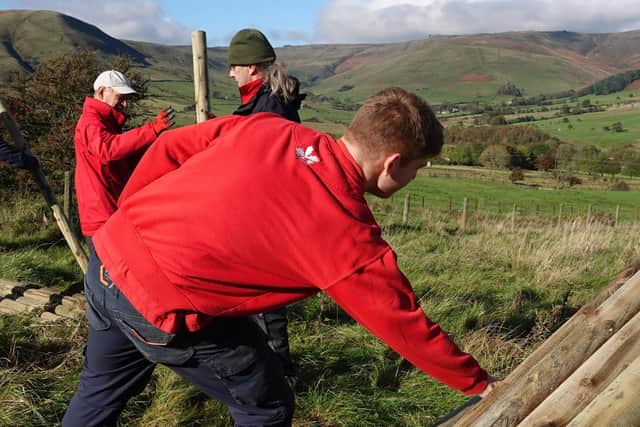 Rangers and volunteers deliver 'exclosure' materials to the site at Dalehead, near Edale (photo: National Trust)