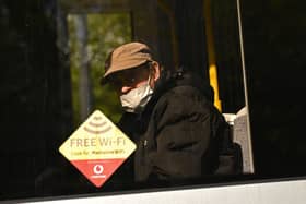 Face coverings are now mandatory on public transport (Photo by OLI SCARFF/AFP via Getty Images)