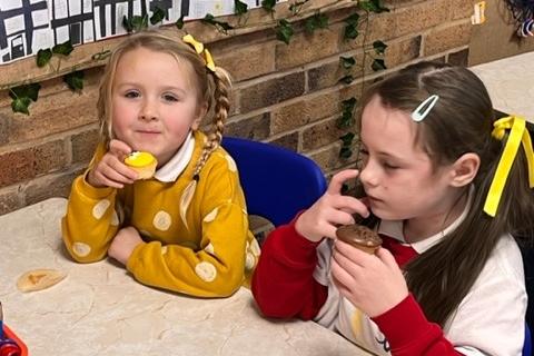 Hayfield Primary pupils tucking into some cake while wearing a dotty jumper. Pic submitted