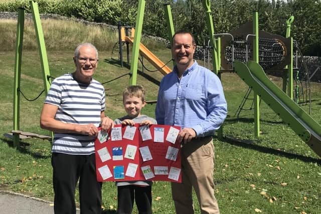 Pictured L-R are Councillor Gordon Rooke, Litton Parish Council, young resident George, and David Wilson, business development manager, Tarmac.