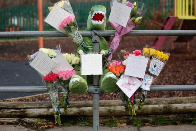 Floral tributes have been left outside Simmondley Primary School.