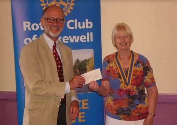 Rotary Bakewell president Chris Webb presents a cheque for Â£600 to Aquabox trustee Roger Cassidy.