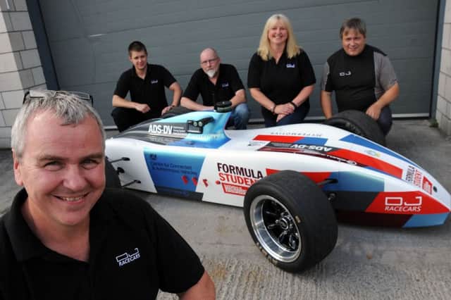 Del Quigley, left, owner of DJ Engineering Services Ltd in Chapel en le Frith, with his wife, Liz, and motorsport engineers, Niall Carmichael, Mick Baker, and Andy Smith with the autonomous driving system which they have developed for the Institution of Mechanical Engineers and showcasing around the country.
