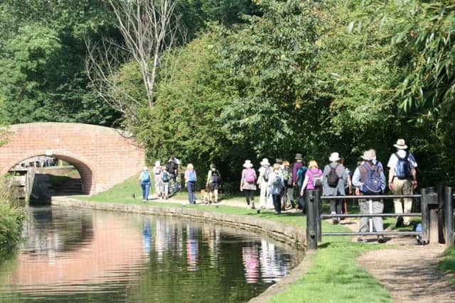 Walkers on the Chesterfield section of the canal towpath.