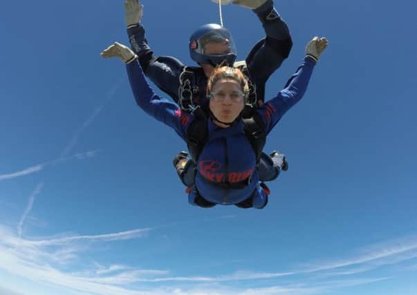 Becky Spray jumped out of plane and raised Â£900 for Blythe House Hospice in memory of her grandad.