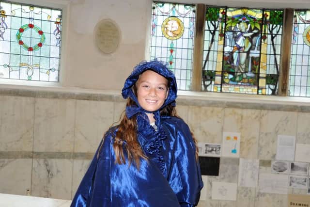 Olivia Holland gets into character during her visit to the Victorian pump for the Buxton Crescent Heritage Trust Family Explorer Day held on Saturday.