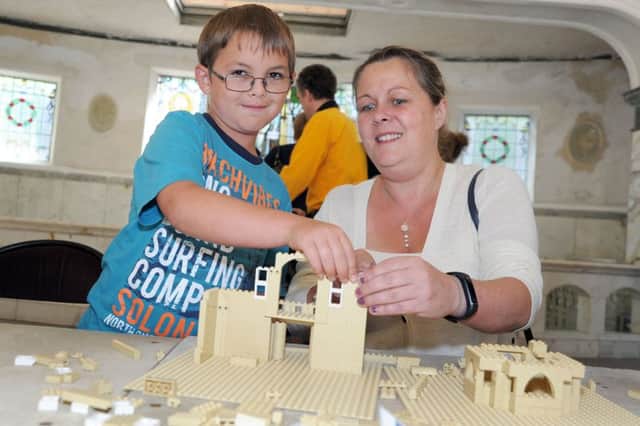 Josh Owen, 8, with his mum, Sarah, create their own version of the pump room during their visit to the Buxton Crescent Heritage Trust Family Explorer Day held on Saturday.