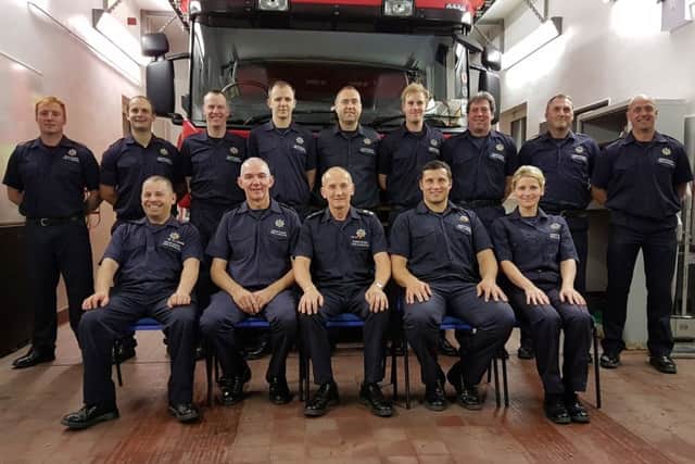 Tim Hutton, front row centre, with the team of Whaley Bridge retained firefighters before he retired