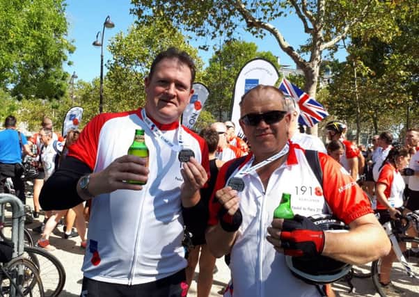 Paul Copper, left, and Alan Tideswell, right, having just finished the Pedal to Paris to raise funds for the Royal British Legion's Poppy Appeal.
