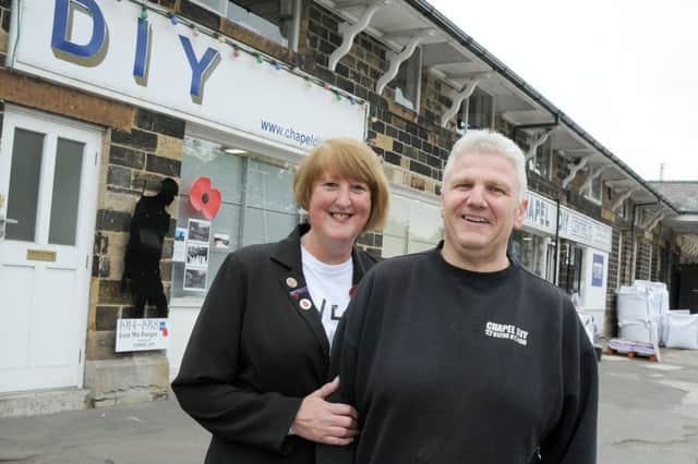 Sally Tideswell, the secretary and Poppy Appeal organiser for the Chapel en le Frith branch of the RBL pictured with Paul Carrington, the owner of Chapel DIY, who were the first business in Chapel to support the silent soldier silhouette scheme.
