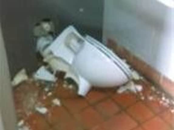 One of the smashed toilets.