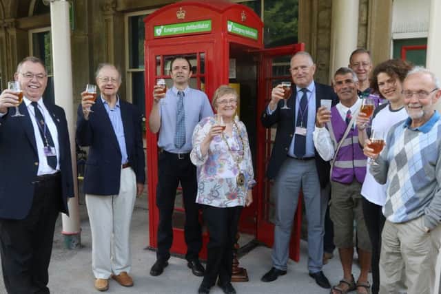 The Friends of Buxton Station and their guests toast the new equipment with beer provided by the Red Willow Brewery