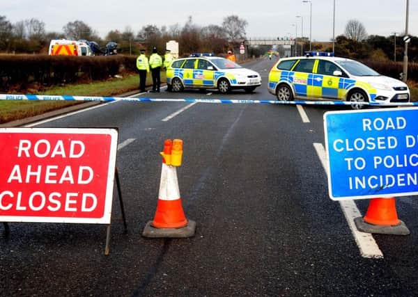 Police on the A614 in Nottinghamshire where six people were killed in a two-car crash.