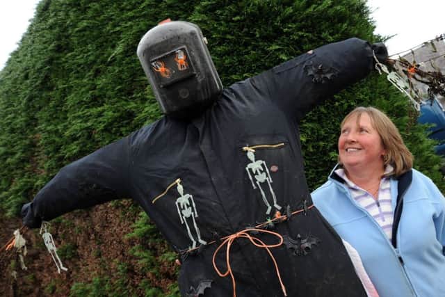 Dove Holes scarecrow festival.
Dove Holes resident, Sue Ball with 'Frank' who has took up residence at her Hallsteads home.