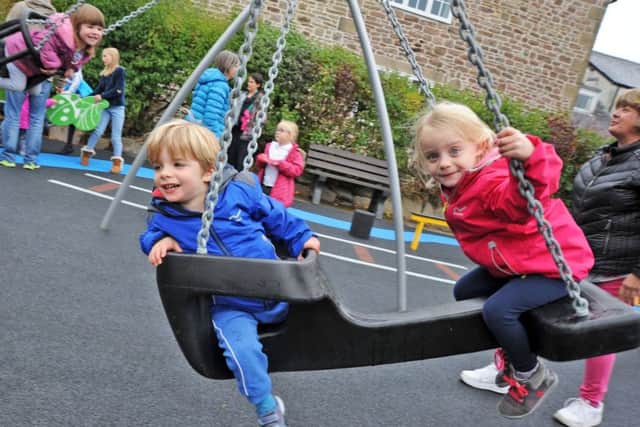 Youngsters try out the new equipment on the Chinley Playground which opened on Monday.