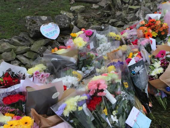 Floral tributes have been left at the scene.