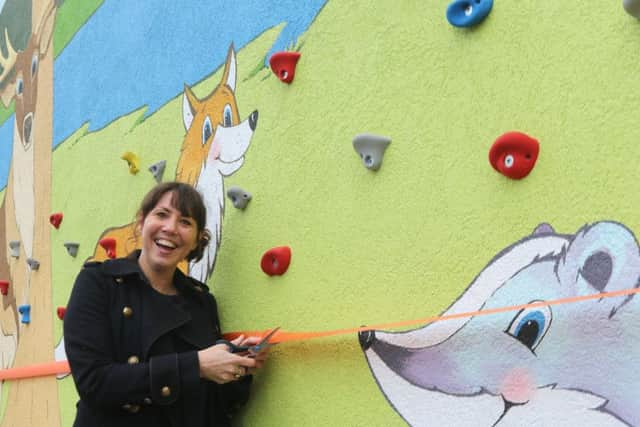 Head teacher Fay Walton cuts the ribbon