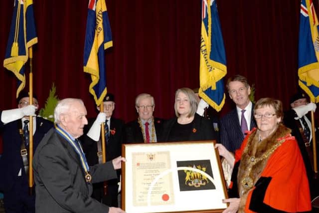 The presentation of the scroll to the Bamford branch of the Royal British Legion.