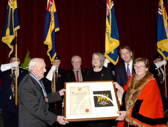 The presentation of the scroll to the Bamford branch of the Royal British Legion.