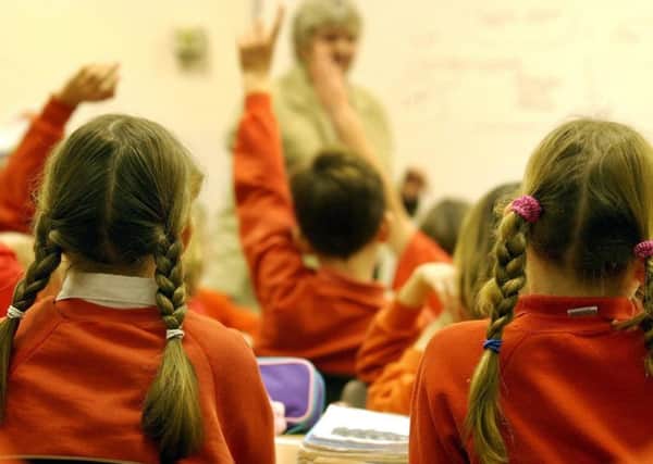 File photo dated 03/12/03 showing young primary school children. Primary school teachers lose more than a million hours of lesson time each year toilet-training children and teaching them basic hygiene, according to new research.