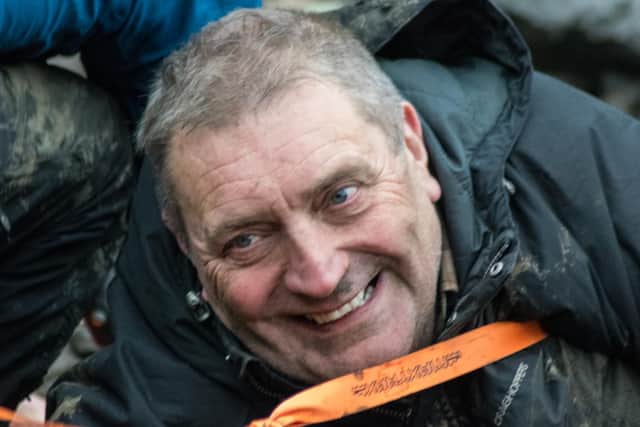 Shaun Taylor kept smiling despite being stuck in mud at Ladybower Reservoir for several hours